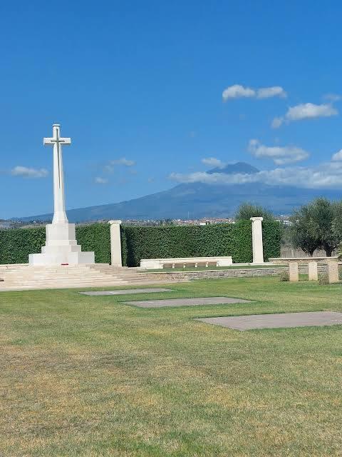 The Commonwealth War Cemetery in Catania, Sicily, Italy with Mount Etna in the background.