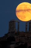 Moon rising over Temple of Poseidon